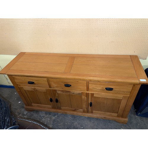 132 - OAK THREE CUPBOARD SIDEBOARD