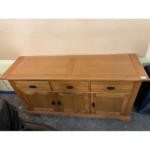 132 - OAK THREE CUPBOARD SIDEBOARD