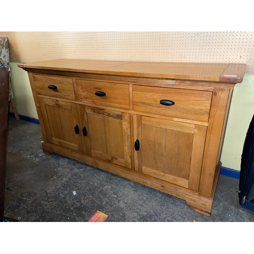 132 - OAK THREE CUPBOARD SIDEBOARD