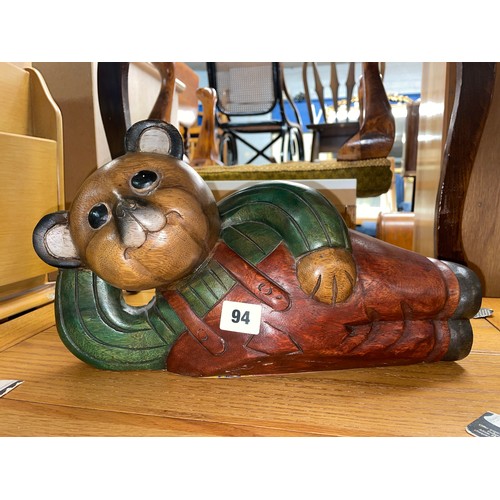 94 - CARVED WOODEN PAINTED RECUMBENT TEDDY BEAR FIGURE