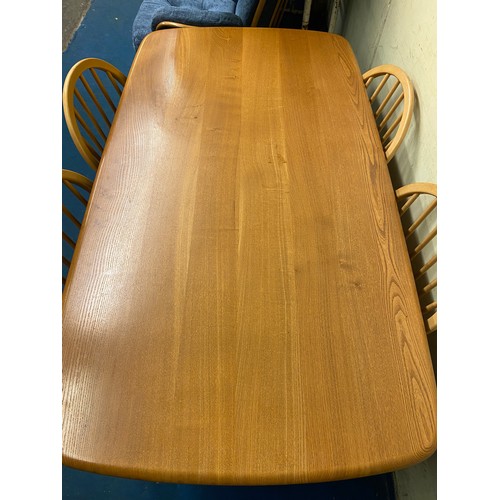 7 - ERCOL LIGHT ELM RECTANGULAR DINING TABLE AND FOUR SPINDLE BACK CHAIRS