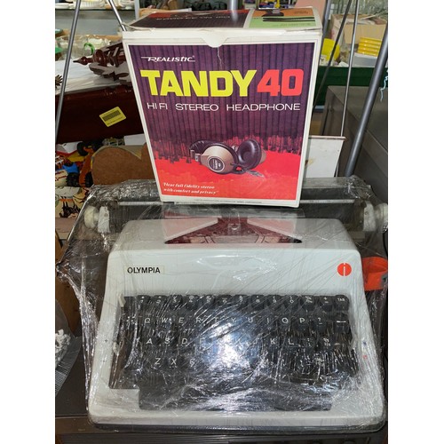 311 - OLYMPIA MANUAL TYPEWRITER AND TANDY 40 HEADPHONES