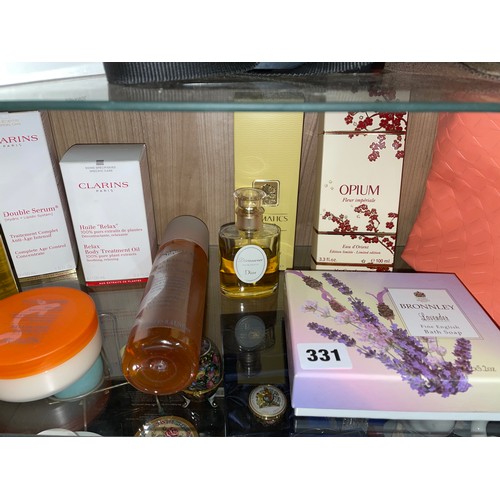 331 - SHELF OF COSMETIC PRODUCTS, CLARINS BATH AND SHOWER OILS, YSL, ETC