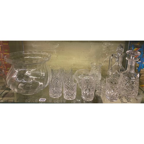 232 - TWO SHELVES OF DIAMOND CUT DRINKING GLASSES, COMMEMORATIVE DECANTER, PUNCH BOWL, AND OTHER GLASSWARE