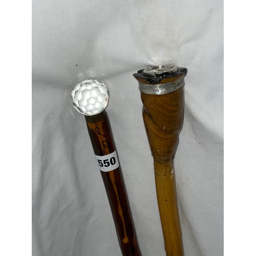 550 - TWO WALKING STAFFS WITH GLASS POMMELS