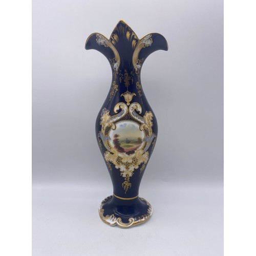 488 - 19TH CENTURY COALPORT STYLE BLEU DE ROI GILDED FLARED VASE WITH A PAINTED PANEL OF A RUIN IN A LANDS... 