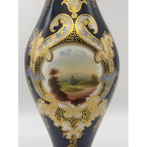 488 - 19TH CENTURY COALPORT STYLE BLEU DE ROI GILDED FLARED VASE WITH A PAINTED PANEL OF A RUIN IN A LANDS... 