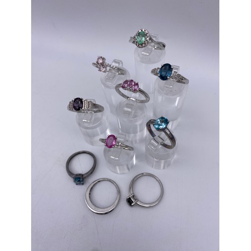 451 - TEN SILVER STONE SET DRESS RINGS