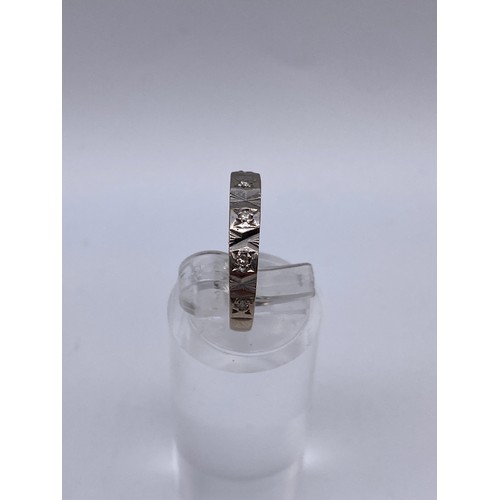 431 - WHITE GOLD STAMPED 750 DIAMOND CHIP BAND SIZE K 2.3G APPROX