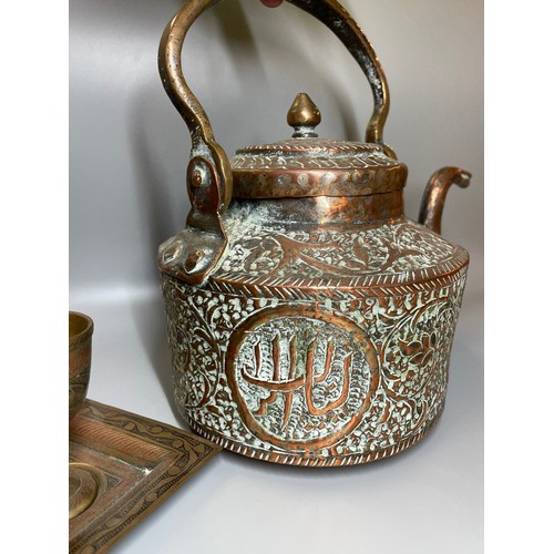 498 - EASTERN COPPER REPOUSSE KETTLE AND ENAMEL BRASS METALWARE GOBLETS ON TRAY