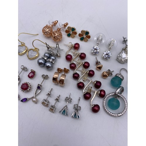 460 - SELECTION OF MAINLY SILVER STONE SET EARRINGS AND TWO 9K RED STONE PENDANTS