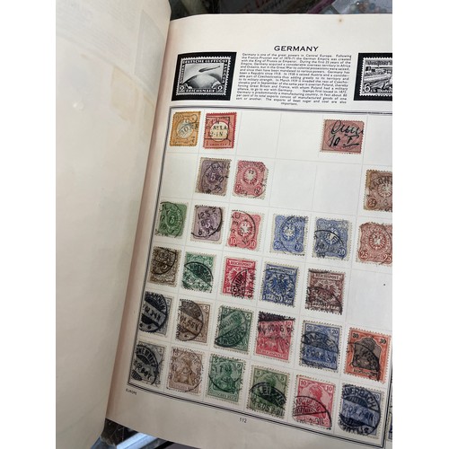 501 - DIPLOMAT AND THE IDEAL STAMP ALBUMS OF WORLD STAMPS, VINTAGE TINS OF FRANKED WORLD STAMPS