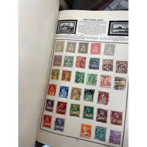 501 - DIPLOMAT AND THE IDEAL STAMP ALBUMS OF WORLD STAMPS, VINTAGE TINS OF FRANKED WORLD STAMPS