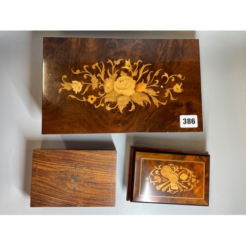 386 - TWO SORRENTO MARQUETRY STYLE MUSICAL BOXES AND A BRASS INLAID HARDWOOD BOX