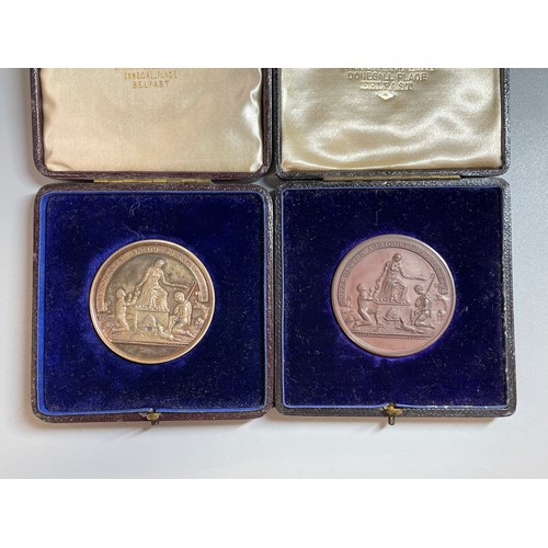 392 - TWO CASED ROYAL ULSTER AGRICULTURAL SOCIETY MEDALLIONS