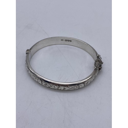 394 - STERLING SILVER ENGRAVED SCALLOPED BROOCH, SILVER ENGRAVED BANGLE WITH SAFETY CHAIN