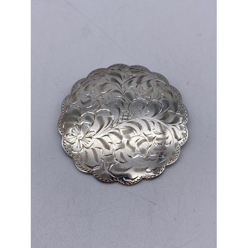 394 - STERLING SILVER ENGRAVED SCALLOPED BROOCH, SILVER ENGRAVED BANGLE WITH SAFETY CHAIN