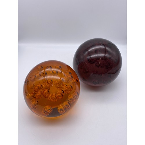 486 - OVERSIZED AMBER AND AMETHYST GLASS CONTROLLED BUBBLE PAPERWEIGHTS