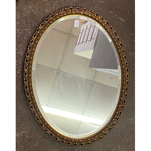 34A - TWO OVAL GILT FRAMED MIRRORS