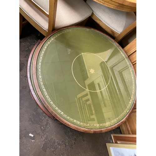 181 - MAHOGANY AND GREEN LEATHER TOPPED CIRCULAR COFFEE TABLE AND NEST OF FOUR COMPACT TABLES