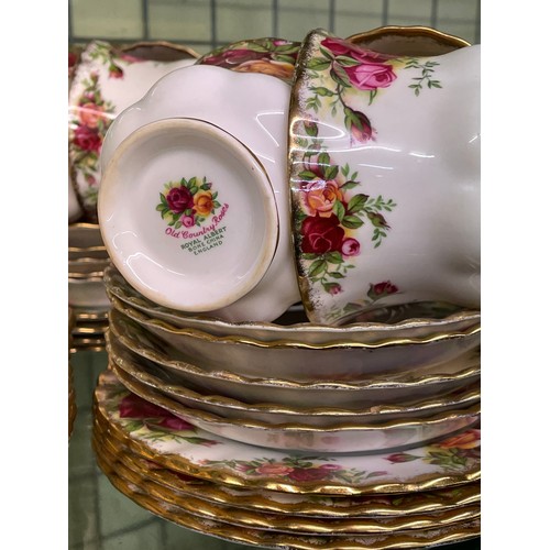 211 - SHELF OF ROYAL ALBERT OLD COUNTRY ROSES DINNER AND TEA SERVICE INC. PLATES, CAKE STAND AND TEAPOT