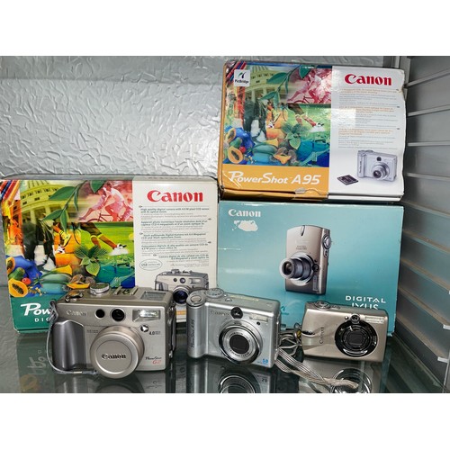 220 - BOXED CANON POWERSHOT G2, POWERSHOT A95, AND A DIGITAL IXUS750 DIGITAL CAMERA