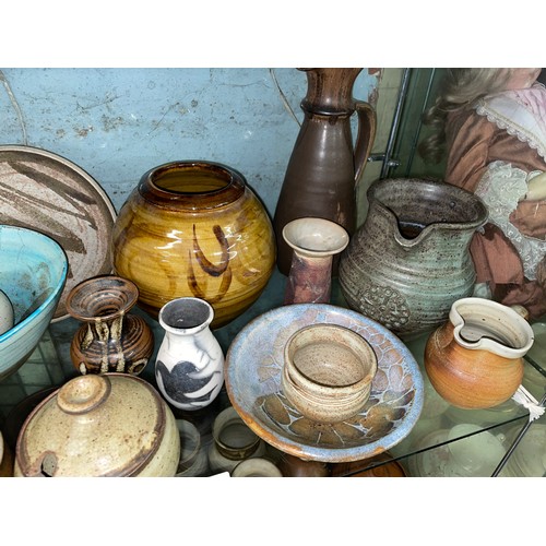 227 - SHELF OF STUDIO POTTERY INCLUDING BOWLS, TAPERED VASES, AND JUGS ETC.