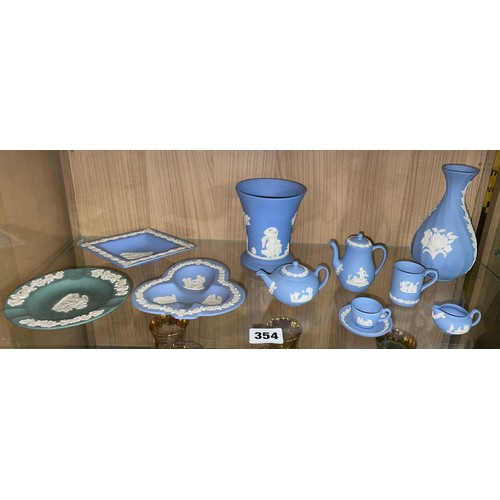 354 - A SELECTION OF WEDGWOOD POWDER BLUE JASPER WARE INCLUDING TRINKET DISHES, VASES, AND MINIATURE COFFE... 