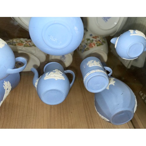 354 - A SELECTION OF WEDGWOOD POWDER BLUE JASPER WARE INCLUDING TRINKET DISHES, VASES, AND MINIATURE COFFE... 