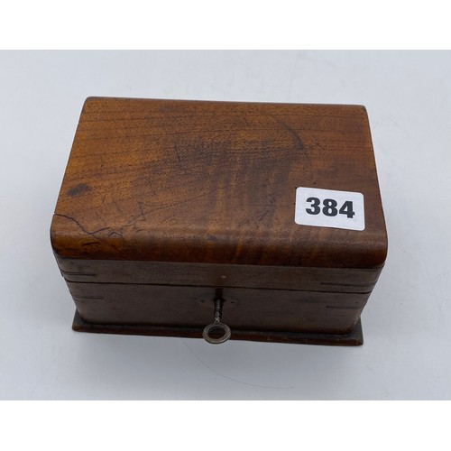 384 - SMALL OAK CASKET CONTAINING VARIOUS COINS AND CURRENCY