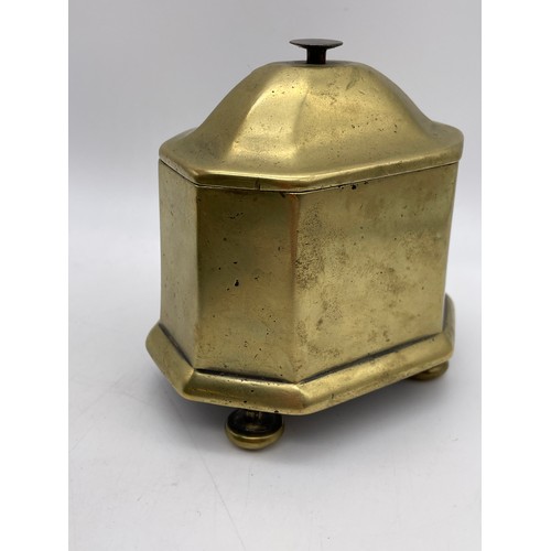 502 - ANTIQUE BRASS OCTAGONAL TOBACCO JAR AND COVER RAISED ON BUN FEET POSSIBLY DUTCH