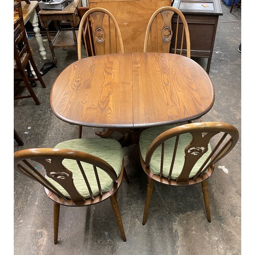 31 - ERCOL EXTENDING DINING TABLE WITH FOUR SWAN CAMEO BACK CHAIRS