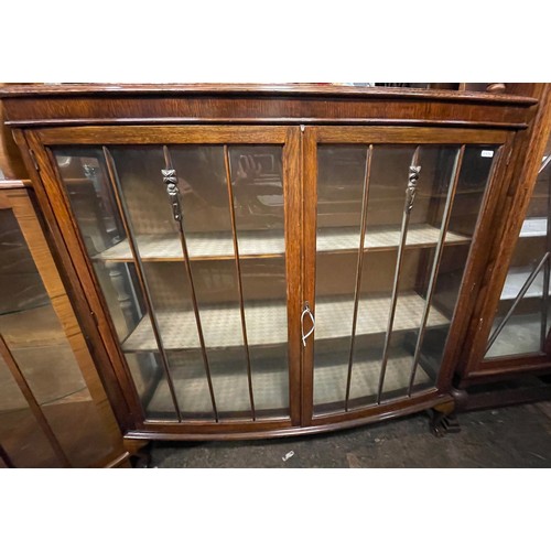 68 - OAK BOW FRONTED GLAZED CABINET ON BALL AND CLAW FEET