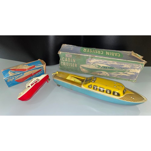 369 - BOXED WELLS AND CO LIMITED CLOCKWORK 166 HIGH SPEED CABIN CRUISER (NO KEY) AND A BOXED METTOY LITHOG... 