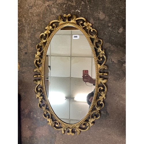 395 - GILT EFFECT ACANTHUS OVAL MIRROR