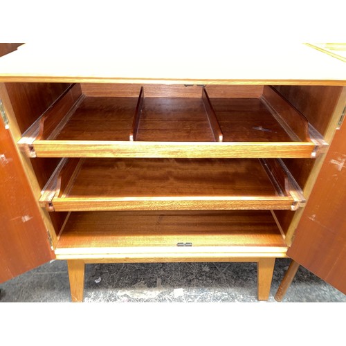 60 - 1960S MEREDEW TWO DOOR CABINET WITH PULL OUT TRAYS