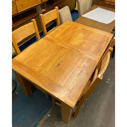 47 - OAK EXTENDING DINING TABLE WITH FOUR LADDER BACK CHAIRS