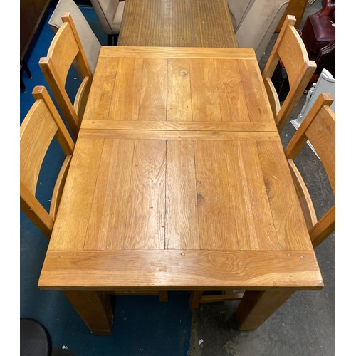 47 - OAK EXTENDING DINING TABLE WITH FOUR LADDER BACK CHAIRS