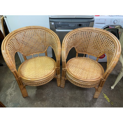 32 - PAIR OF BAMBOO AND RATTAN BASKET BACKED ARMCHAIRS