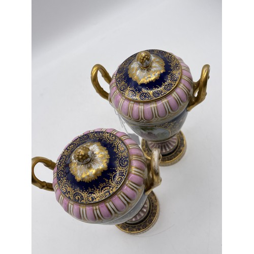 539 - PAIR OF VIENNA OVOID TWIN HANDLED PEDESTAL VASES AND COVERS DECORATED WITH PANELS OF FIGURES ON A BL... 