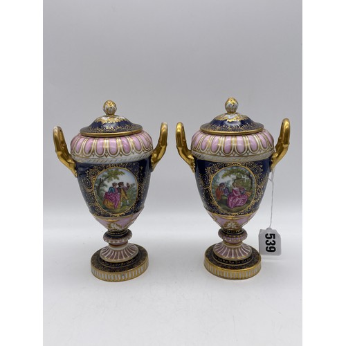 539 - PAIR OF VIENNA OVOID TWIN HANDLED PEDESTAL VASES AND COVERS DECORATED WITH PANELS OF FIGURES ON A BL... 