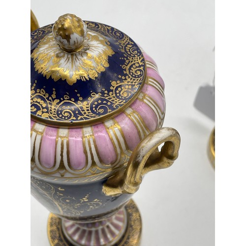 539 - PAIR OF VIENNA OVOID TWIN HANDLED PEDESTAL VASES AND COVERS DECORATED WITH PANELS OF FIGURES ON A BL... 