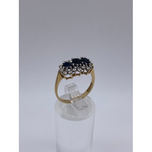 504 - 9CT GOLD CZ AND CHANNEL SET DRESS RING 2.4G APPROX