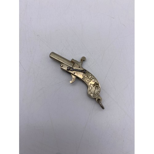 526 - MINIATURE HOLSTER PISTOL IN BOX