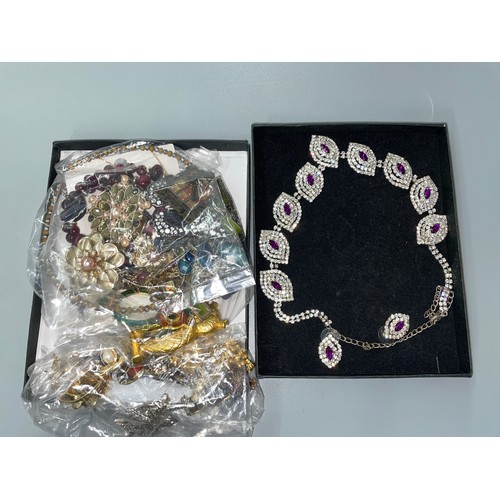 514 - TWO BAGS OF MISCELLANEOUS COSTUME JEWELLERY, BEADS, EARRINGS, BOXED DIAMANTE AND PURPLE STONE NECKLA... 