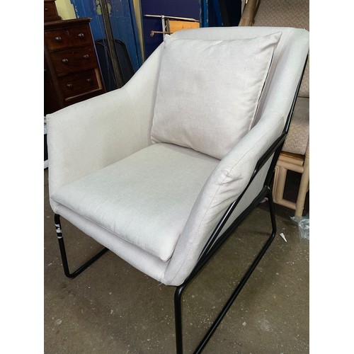 29 - GREY CANVAS AND TUBULAR FRAMED EASY CHAIR WITH BOLSTER CUSHION