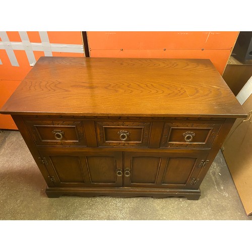 81 - OLD CHARM OAK CARVED MEDIA CABINET