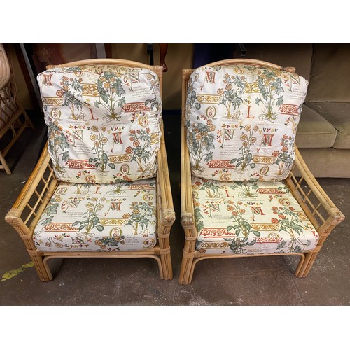 69 - PAIR OF BAMBOO FLORAL CUSHION CONSERVATORY ARMCHAIRS