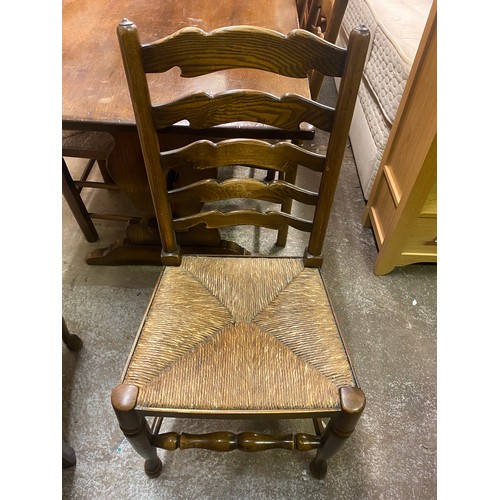 156 - GOOD QUALITY OAK REFECTORY TABLE AND SIX LANCASHIRE STYLE LADDERBACK CHAIRS