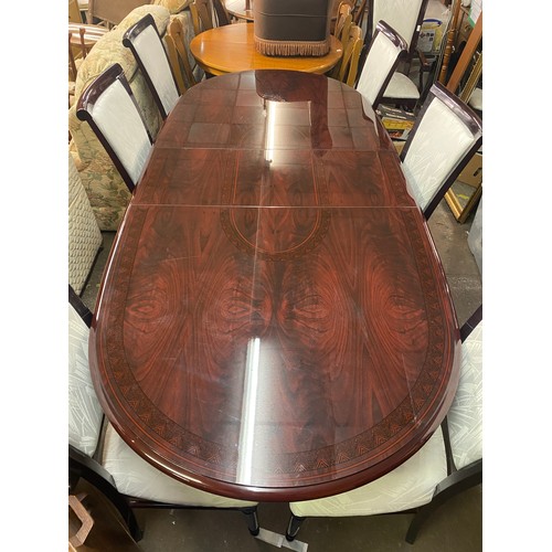 34 - DARK ROSEWOOD AND MARQUETRY EFFECT PEDESTAL EXTENDING DINING TABLE AND EIGHT CHAIRS